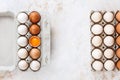 Variety of fresh organic eggs in recycled cardboard boxes, one cracked open Royalty Free Stock Photo