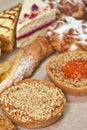 A variety of fresh pastries. Closeup on a light background, vertical shot Royalty Free Stock Photo