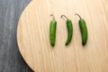 Variety of fresh vegetables in basket and chopping board ready to cook a Mexican sauce: onion, tomato, green chilies Royalty Free Stock Photo