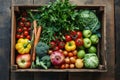 A variety of fresh vegetables neatly arranged and packed in a wooden box for easy visibility and access, A gift box mimicking a Royalty Free Stock Photo