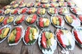 Variety of Fruit Catering in plastic wrap to serve on wooden table with reflect on plastic high constrast