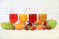 Variety of fruit juices and fruits, juice vitamin bar concept. Royalty Free Stock Photo