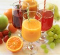 Variety of fruit juices and fruits, juice vitamin bar concept. Royalty Free Stock Photo