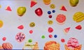Variety of fruits alongwith ice cream cones painted on a wall