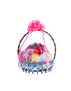 Variety of fruits in the gift wood basket with pink flower ribbon isolated on white background with clipping path