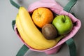 Variety of fruits grapefruit, kiwi, banana, orange from pink li Royalty Free Stock Photo