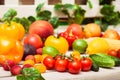 Variety of fruits and vegetables scattered on the white bench en