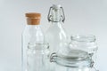 A variety of glass jars and bottles at white backdrop. Zero waste concept. Royalty Free Stock Photo