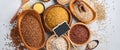 Variety of grains. Assorted cereals white, brown and red rice, buckwheat, millet, corn groats, quinoa and bulgur in wooden bowls.