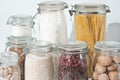 Variety of grains, beans and pasta in glass jars. Zero waste storage concept. Air tight glass jars