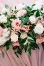 Variety of greens and flowers in the wedding bouquet on the table of newlyweds Royalty Free Stock Photo