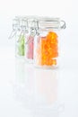 Variety of gummi bears in a preserving jar on white background Royalty Free Stock Photo