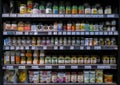 Variety of herbs and spices seasoning product on shelves in a grocery store supermarket