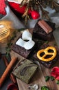 Variety Homemade Mini Brownies on Wooden Board with Christmas Decorated on Background
