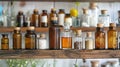 Variety of homeopathic remedies in glass bottles, arranged in an orderly fashion on a wooden shelf. Concept of Royalty Free Stock Photo