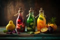 Variety of infused detox water in bottles with fruits and berries on rustic wooden background.