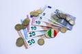 Variety of Italian banknotes and coins with italian flag Royalty Free Stock Photo