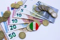 Variety of Italian banknotes and coins with italian flag Royalty Free Stock Photo