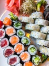 Variety of japanese sushi rolls on a white plate Royalty Free Stock Photo