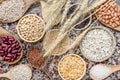 Variety kind of dry organic cereal and grain seeds in wooden bowl in dark tone