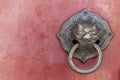 Knockers and handles on ancient doors, Old metal door handle on a wooden door