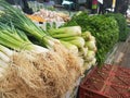 A variety of leafy vegetables at the market stand