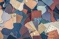 Variety of leather samples of different textures and colors, abstract background, top view, manufacturing concept Royalty Free Stock Photo