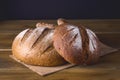 Variety of Loafs Fresh Baked Rye and Whole Grain Bread on Wooden Texture Background Dark Photo Variety of Bread Toned Royalty Free Stock Photo