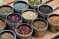 Variety of Loose Leaf Teas and Herbal Blends in Tin Containers