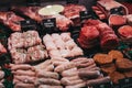 Variety of meats and meat products on sale inside The Courtyard country mall in Elveden, UK