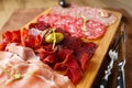 Variety of meats, sausages, salami, ham, olives Royalty Free Stock Photo