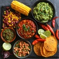 Generative AI. Vibrant Spread of Mexican Cuisine Featuring Salsa, Guacamole, and Beans on a Slate Surface Royalty Free Stock Photo