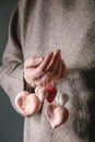 Felted hearts in female hands