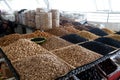 A variety of nuts in boxes and bags and dried fruits, raisins and prunes at the Chorsu Bazaar in Tashkent, Uzbekistan