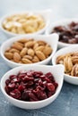 Variety of nuts and dried fruits in small bowls Royalty Free Stock Photo