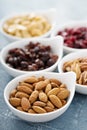 Variety of nuts and dried fruits in small bowls Royalty Free Stock Photo