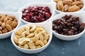 Variety of nuts and dried fruits in small bowls Royalty Free Stock Photo