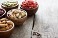 Variety of nuts and dried fruits in small bowls Royalty Free Stock Photo