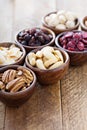 Variety of nuts and dried fruits in small bowls Royalty Free Stock Photo