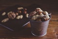 Variety nuts, peanuts, walnuts and hazelnuts wooden background.