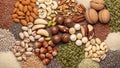 A variety of nuts and seeds are displayed on a wooden surface Royalty Free Stock Photo