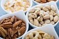 Variety of nuts in small bowls Royalty Free Stock Photo