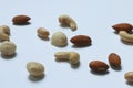 Variety of nuts on white background. Macadamia,cashew,peanuts and almond nuts. Royalty Free Stock Photo