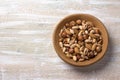 Variety of nuts in wooden bowl over wooden table. almonds, walnuts, hazelnuts, pistachios Royalty Free Stock Photo