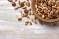 Variety of nuts in wooden bowl over wooden table. almonds, walnuts, hazelnuts, pistachios Royalty Free Stock Photo