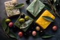 Variety of options handmade olive soaps with fresh olives and olive branch with leaves on wooden background top view. Spa, hygiene