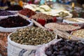 Variety organic okra and dates in sacks on sale on a farmers market. Traditional arabic market Royalty Free Stock Photo