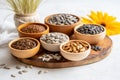 Variety organic seeds on wooden board, health-focused nutrition for hormone balance, seed cycling.