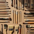 A variety of paintbrushes are arranged on a flat surface, showcasing different shapes Royalty Free Stock Photo