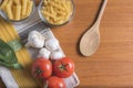 Variety of pasta with tomatoes, basil, mushrooms and garlic Royalty Free Stock Photo